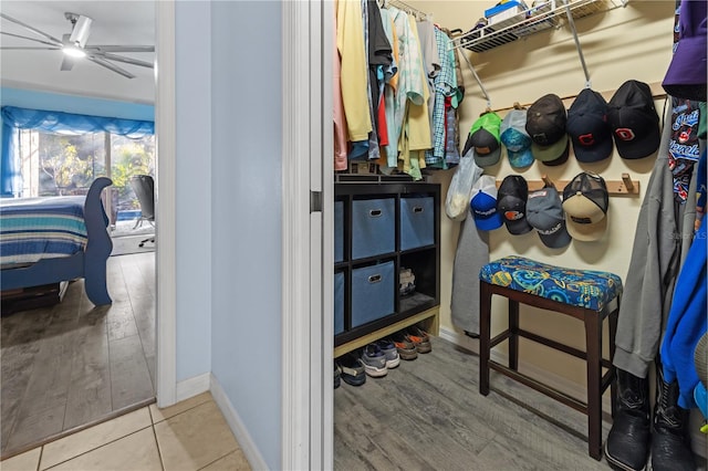 spacious closet featuring hardwood / wood-style floors and ceiling fan