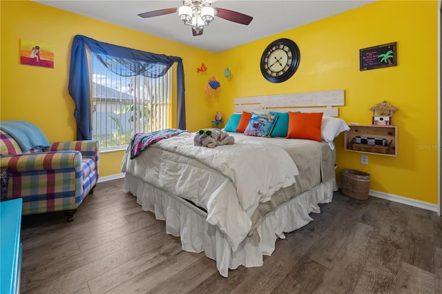 bedroom with ceiling fan and hardwood / wood-style flooring