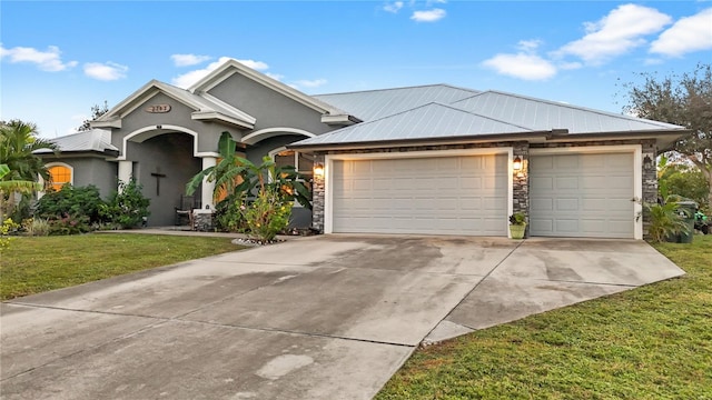 view of front of house with a garage and a front lawn