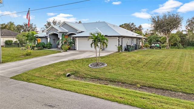 view of front of house with a garage and a front lawn