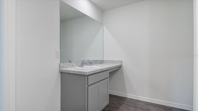 bathroom featuring vanity and hardwood / wood-style flooring