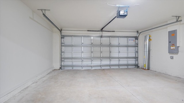 garage featuring a garage door opener and electric panel