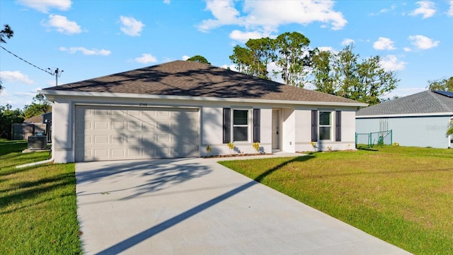 single story home with a front yard and a garage