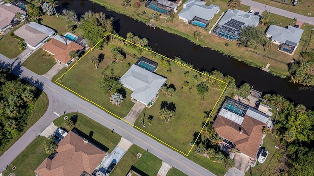 birds eye view of property featuring a water view