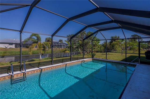 view of pool with a yard and a lanai