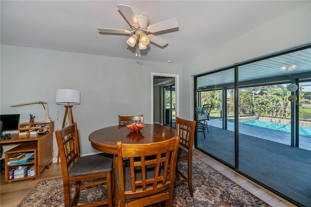 dining room featuring ceiling fan and light hardwood / wood-style flooring