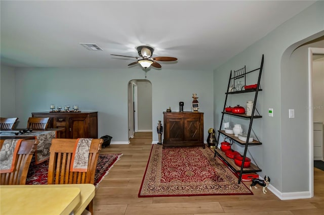 dining space featuring light hardwood / wood-style flooring and ceiling fan