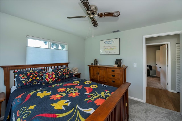 bedroom featuring hardwood / wood-style floors and ceiling fan