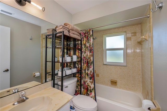 full bathroom featuring vanity, shower / tub combo, and toilet