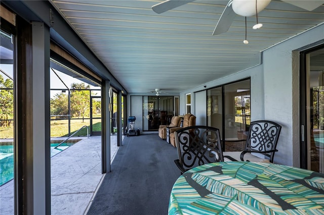 sunroom / solarium with ceiling fan