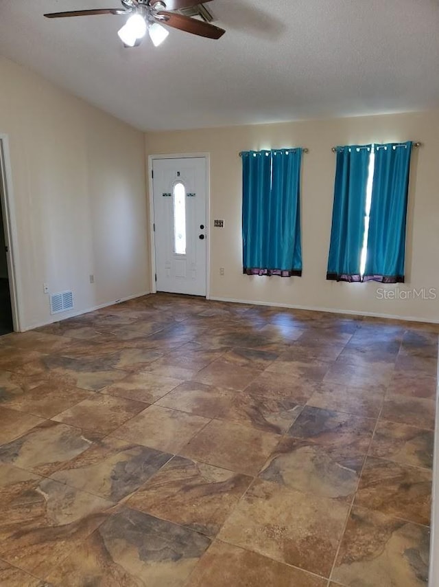 entrance foyer featuring ceiling fan