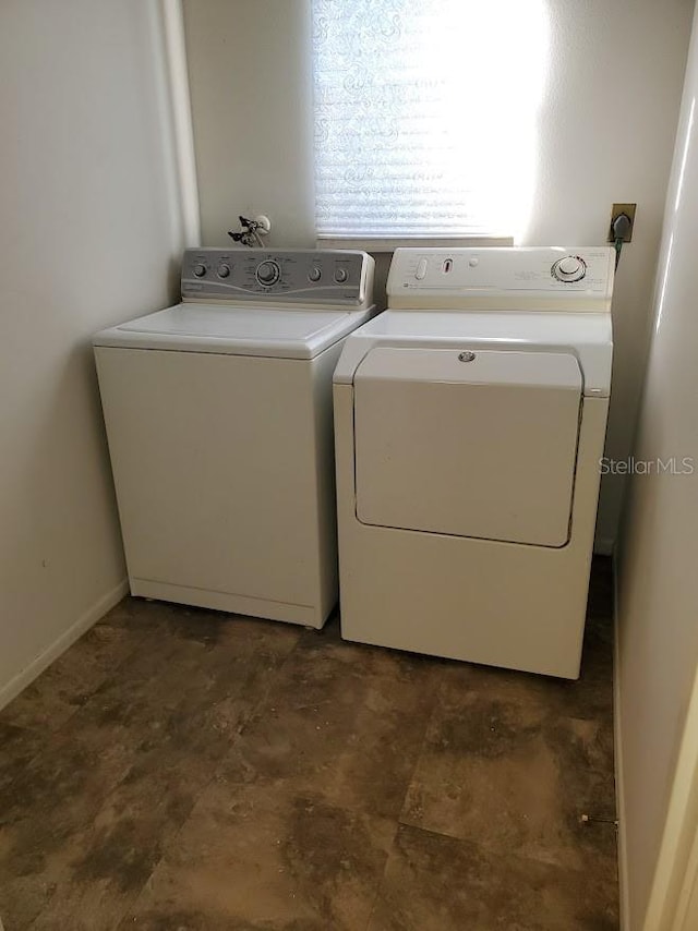 laundry area with independent washer and dryer