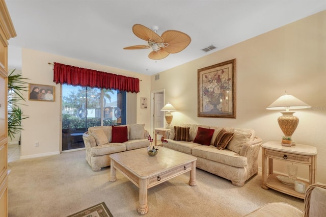 living room with ceiling fan and light colored carpet