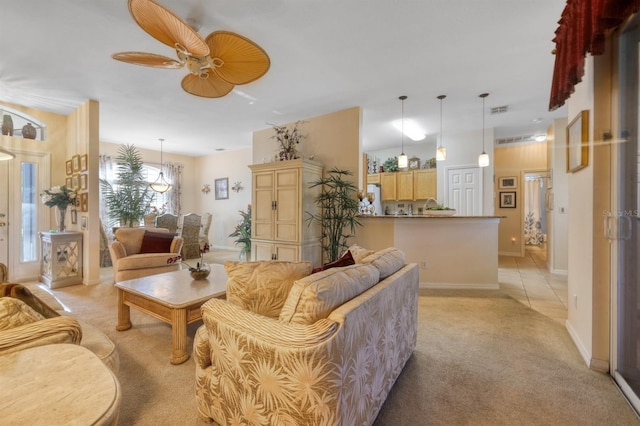 carpeted living room with ceiling fan