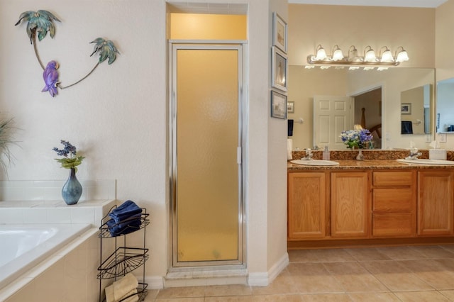 bathroom featuring tile patterned floors, vanity, and independent shower and bath