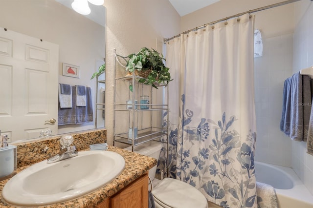 full bathroom featuring vanity, toilet, and shower / tub combo