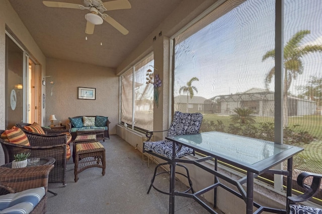 sunroom with ceiling fan