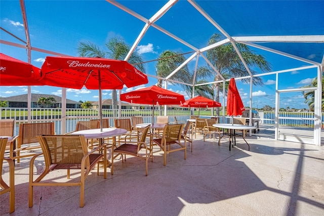 view of patio / terrace with a lanai