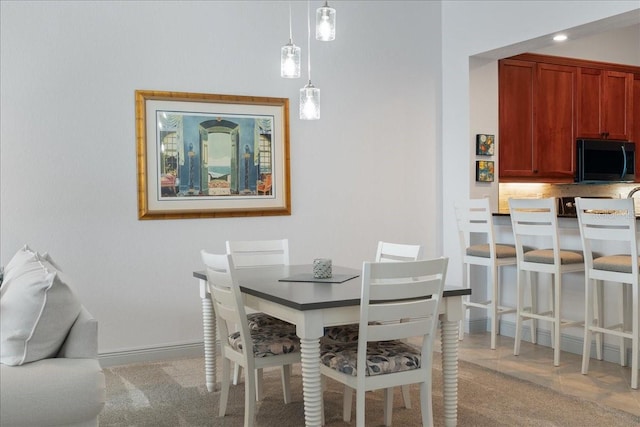 view of carpeted dining area