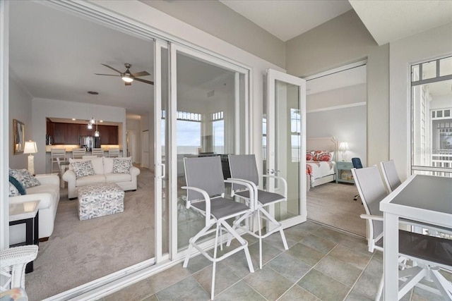 sunroom / solarium with ceiling fan