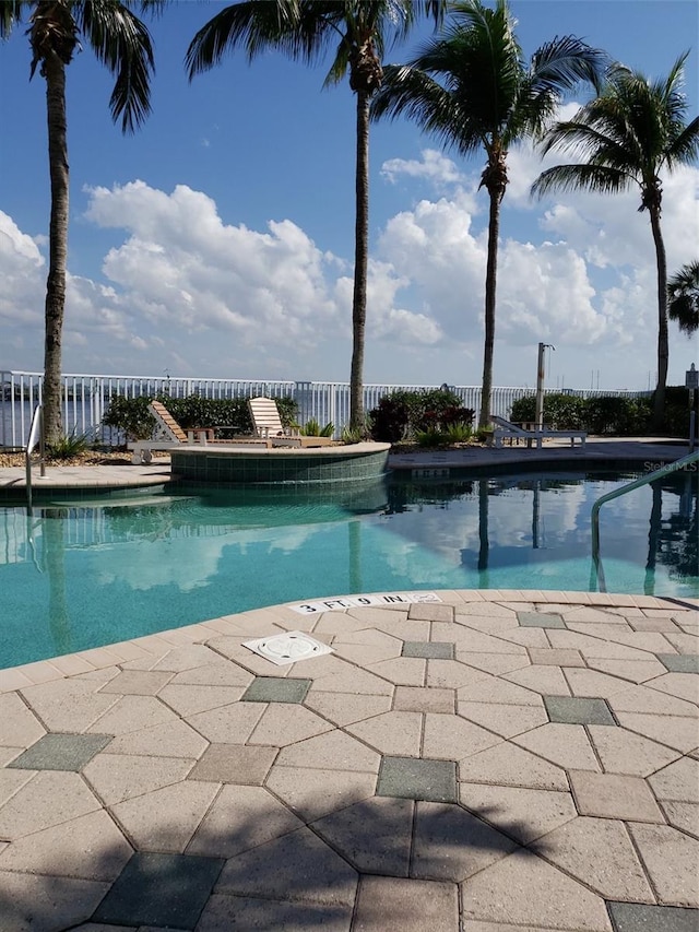 view of swimming pool featuring a patio