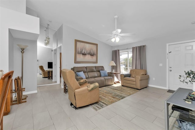 tiled living room with ceiling fan and vaulted ceiling