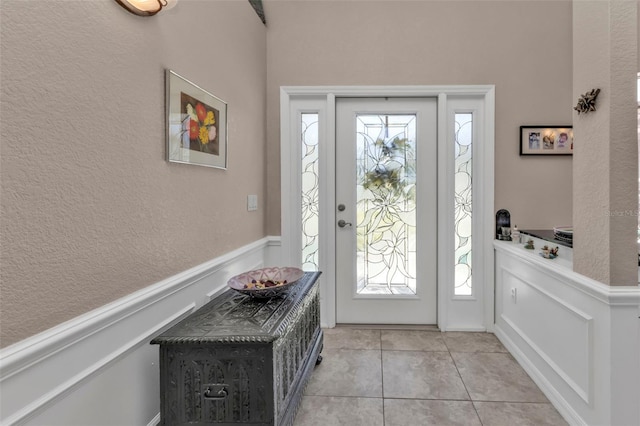 foyer entrance featuring light tile patterned floors