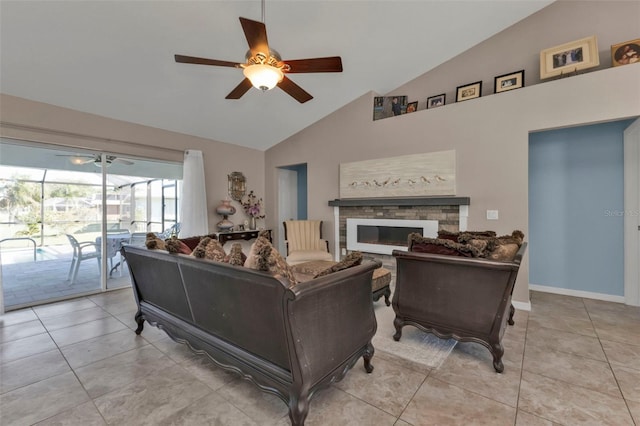 tiled living room with ceiling fan, a fireplace, and high vaulted ceiling