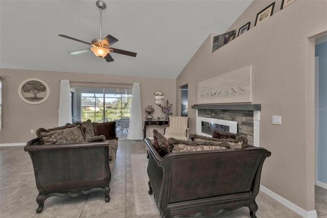 living room with a fireplace, light tile patterned floors, high vaulted ceiling, and ceiling fan