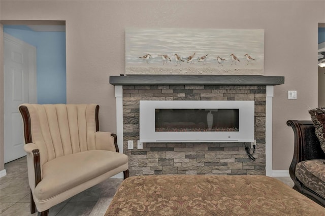 living area featuring a fireplace and light tile patterned floors