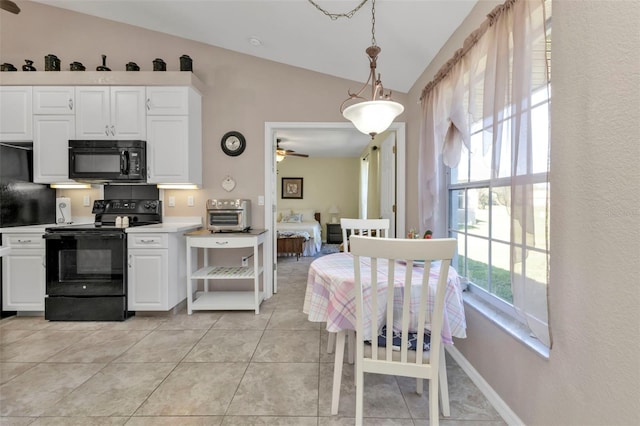 kitchen with ceiling fan, hanging light fixtures, lofted ceiling, white cabinets, and black appliances