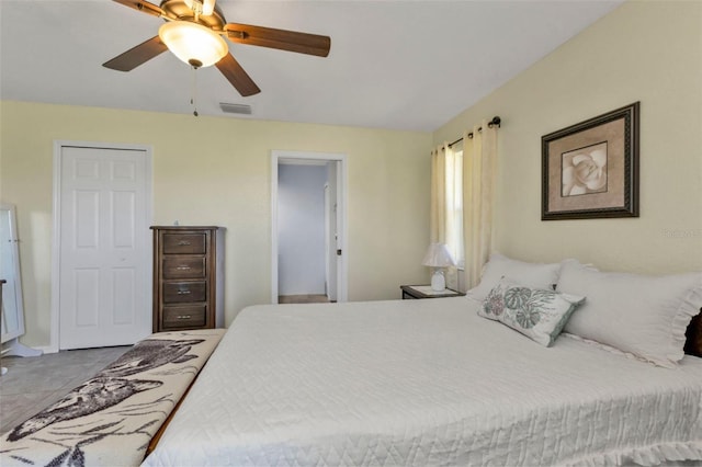 bedroom featuring tile patterned floors and ceiling fan