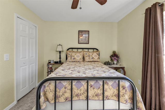 bedroom with access to outside, ceiling fan, a closet, and light tile patterned floors