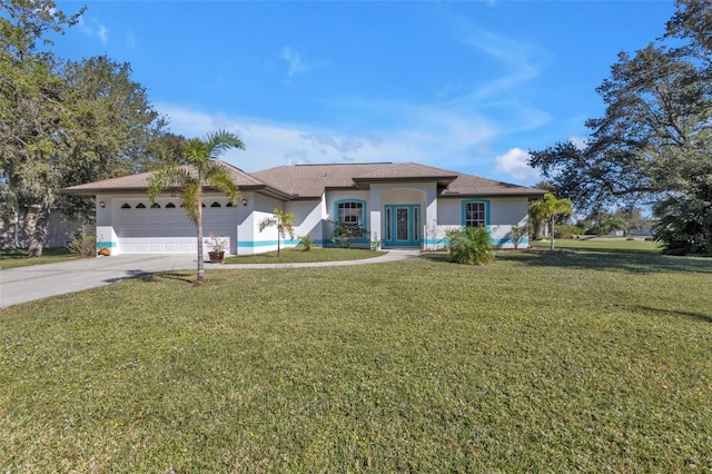 view of front facade featuring a garage and a front lawn