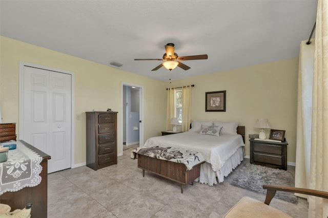 bedroom featuring a closet, visible vents, a ceiling fan, and baseboards