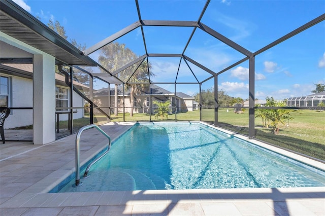 pool with a patio, a lawn, and a lanai
