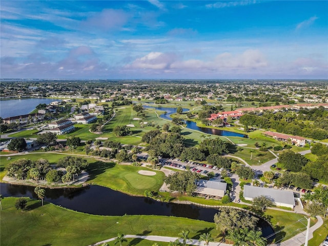 birds eye view of property featuring golf course view and a water view