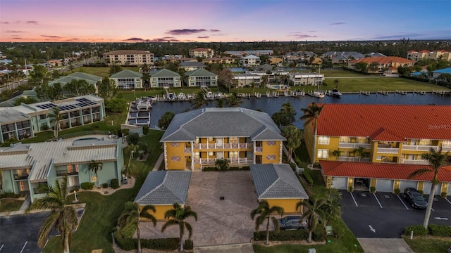 aerial view at dusk with a water view