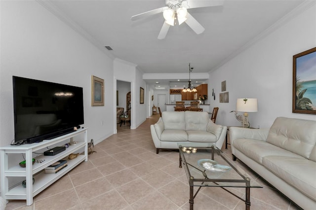 tiled living room with crown molding and ceiling fan with notable chandelier