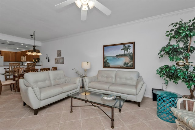 tiled living room featuring ceiling fan with notable chandelier and crown molding