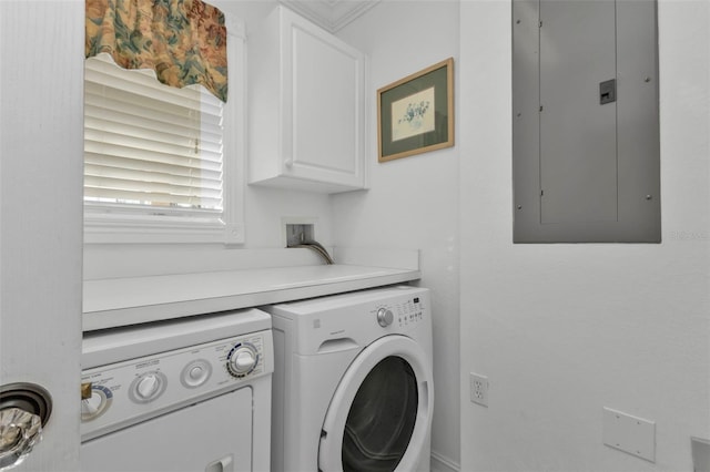 laundry area with washer and dryer, cabinets, ornamental molding, and electric panel