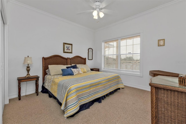 carpeted bedroom featuring ceiling fan and crown molding