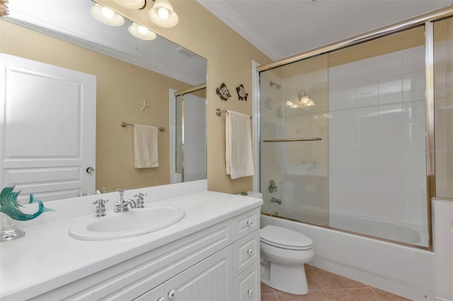 full bathroom featuring tile patterned floors, bath / shower combo with glass door, toilet, vanity, and ornamental molding