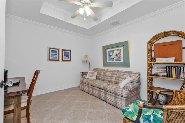 office with a tray ceiling, light tile patterned flooring, and ornamental molding