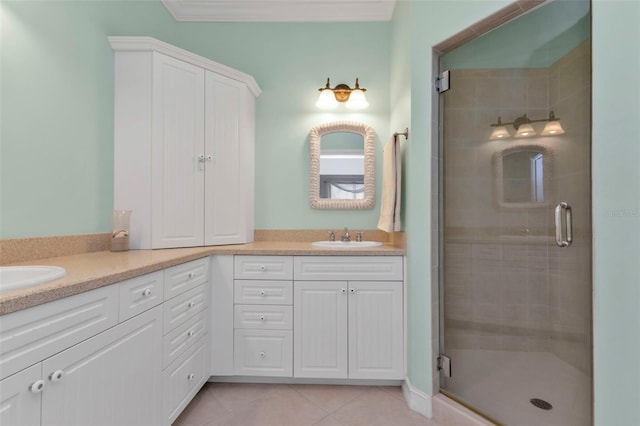 bathroom with tile patterned floors, vanity, an enclosed shower, and ornamental molding