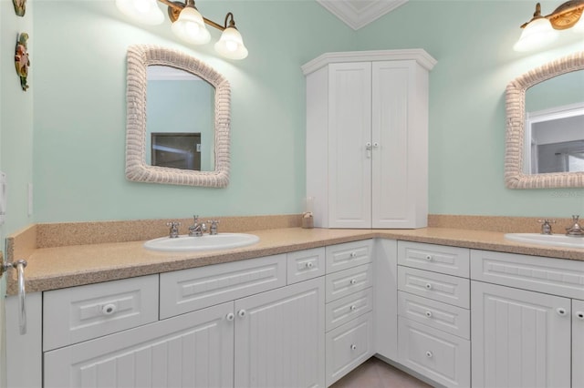 bathroom with vanity and crown molding