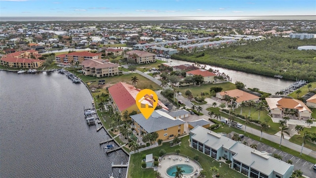 birds eye view of property featuring a water view