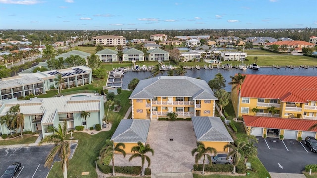 birds eye view of property featuring a water view