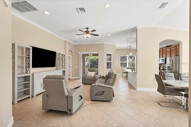 living room featuring ceiling fan, light tile patterned flooring, and crown molding