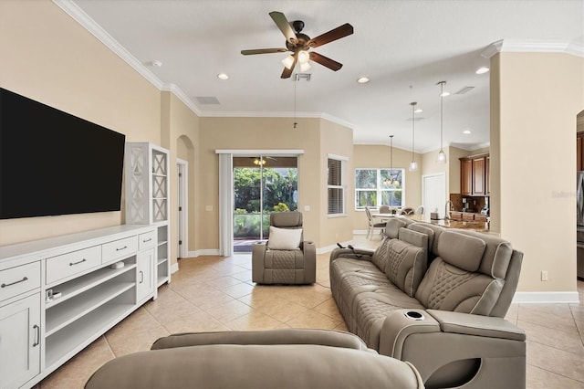 living room with ceiling fan, light tile patterned floors, and ornamental molding